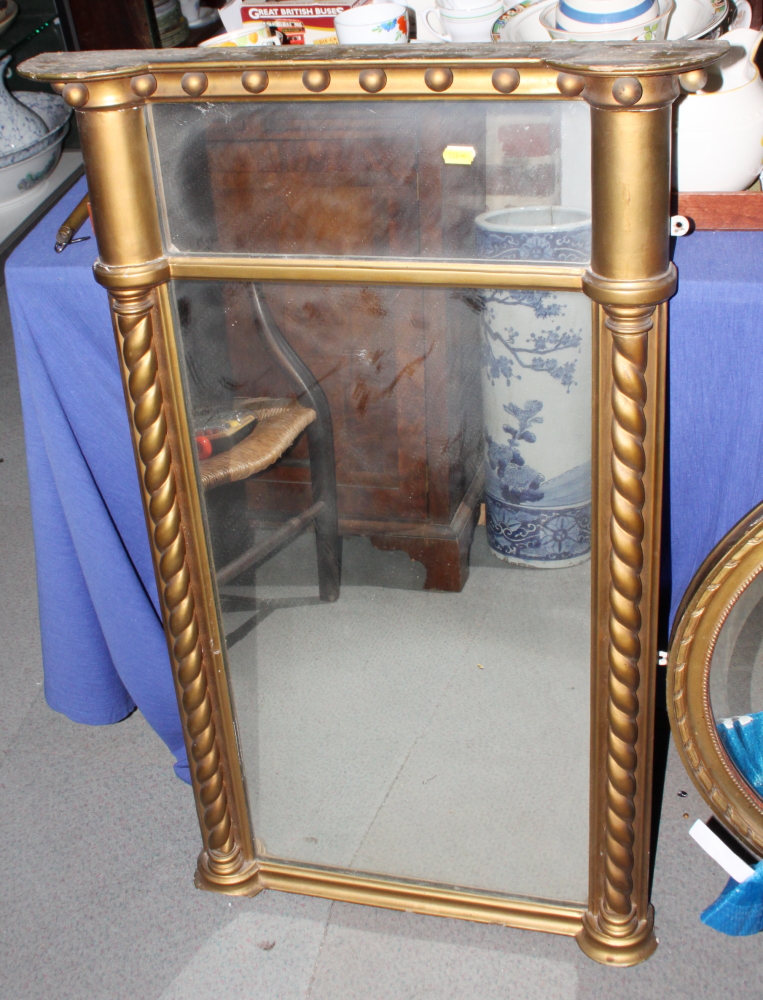A 19th century design overmantel mirror, in gilt frame, decorated twist turned pilasters, 24" x 38"
