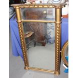 A 19th century design overmantel mirror, in gilt frame, decorated twist turned pilasters, 24" x 38"
