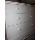 A white painted pine chest of two short and two long drawers, 42" wide