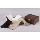 Five pairs of lady's gloves and a Boot's first aid box