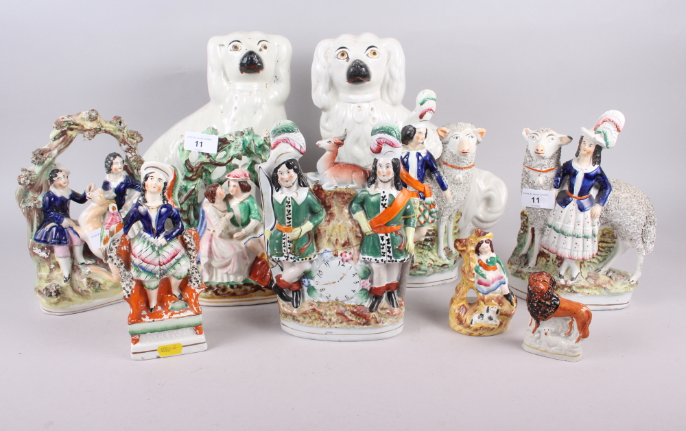 A pair of 19th century Staffordshire spaniels, 11" high, and eight Staffordshire pottery groups