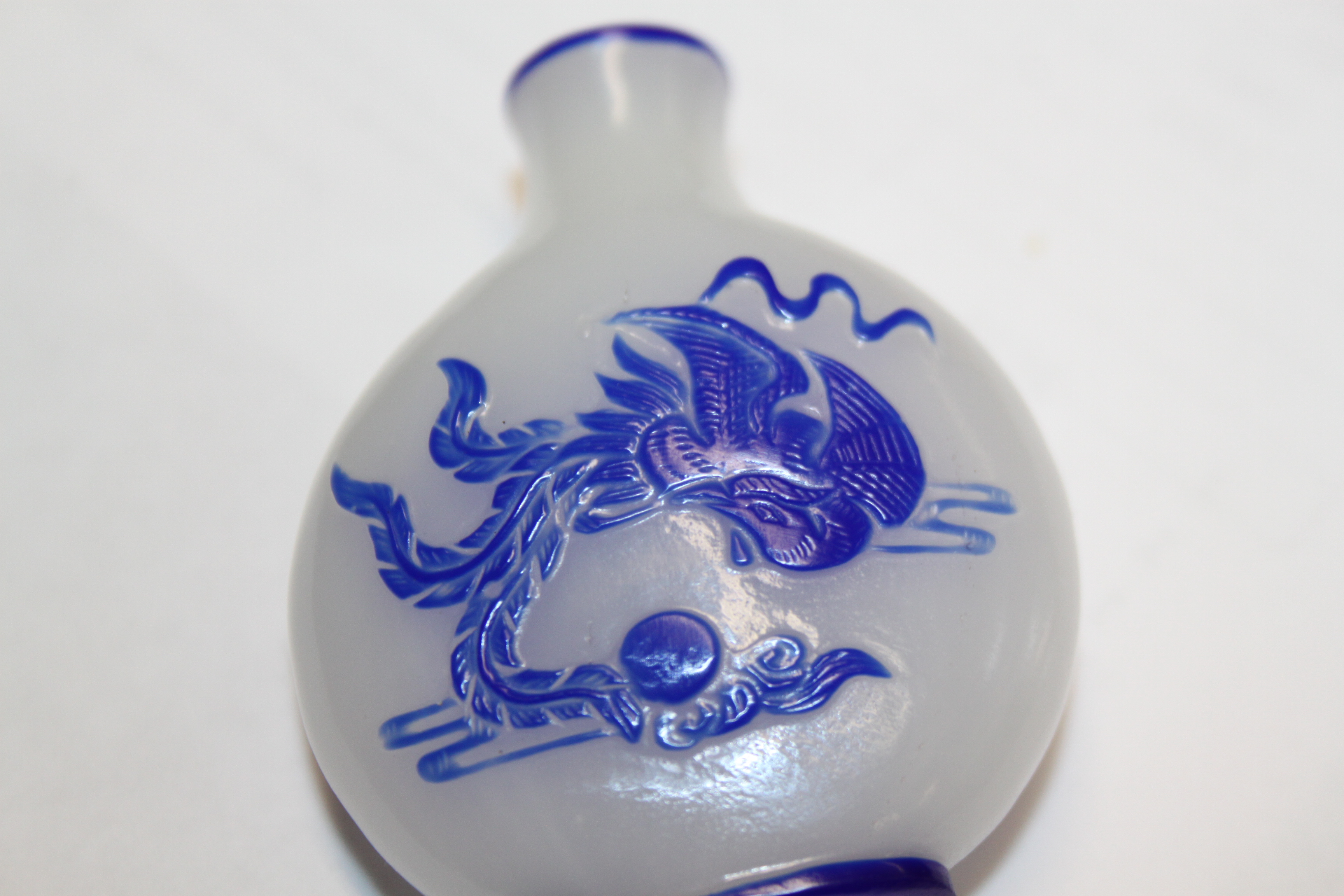 A Chinese blue and white cameo glass snuff bottle, decorated dragon, 2 1/4" high, and a shallow blue - Image 8 of 13