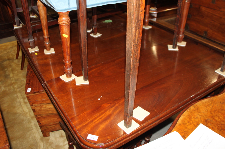 A William IV period mahogany extending table, fitted two leaves, on turned and reeded supports,