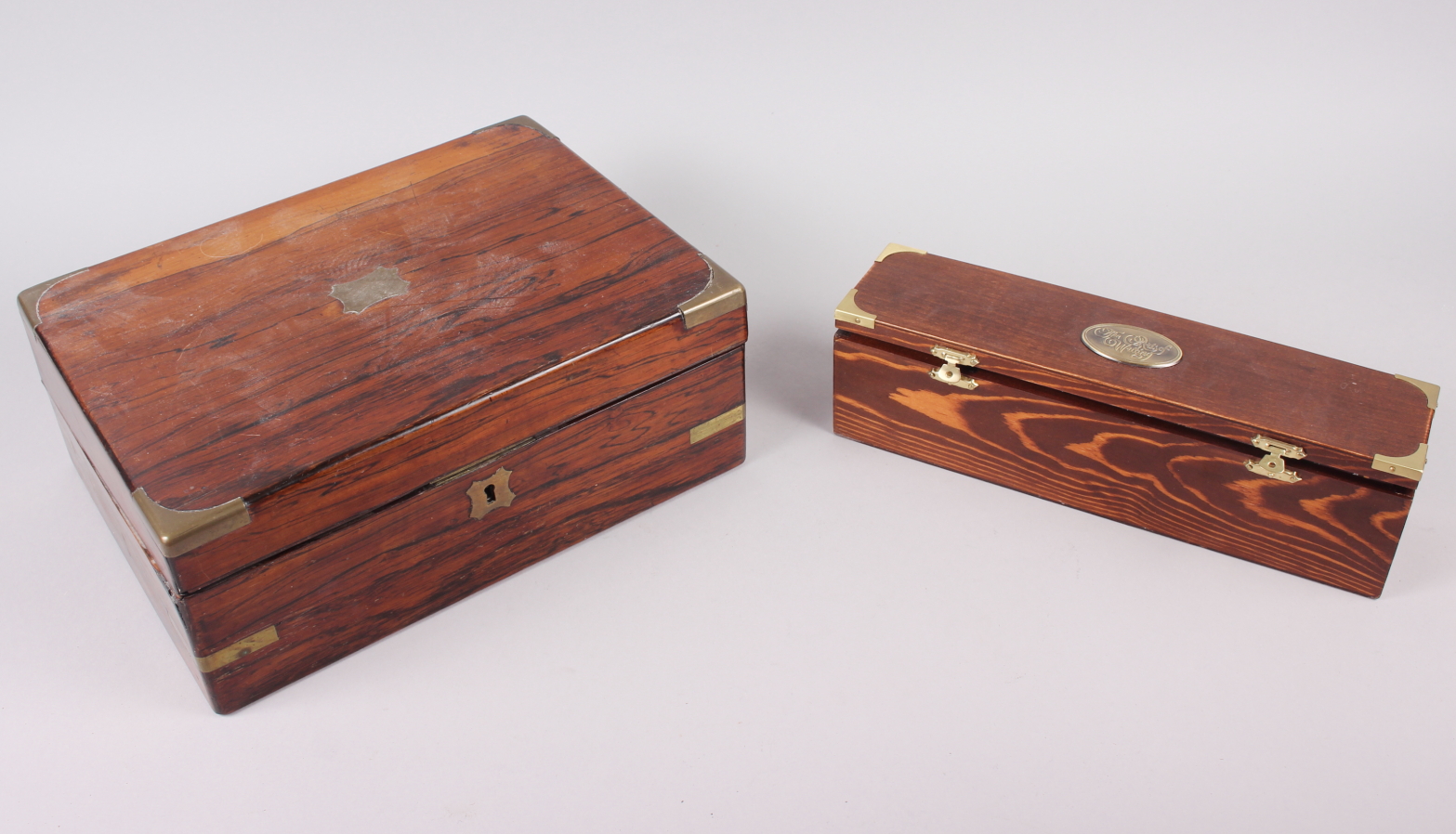 A 19th century rosewood writing box inset brass corners, 12" across, and a boxed calligraphy set