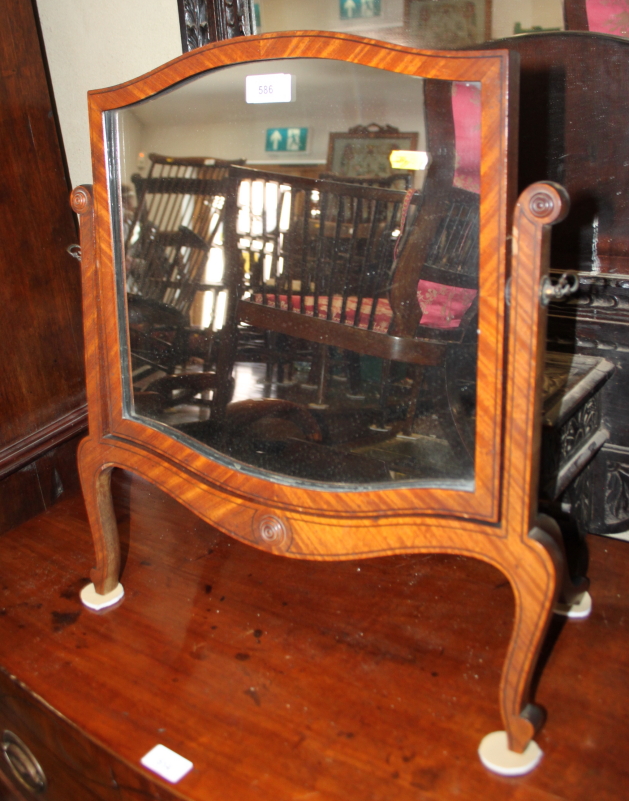 A rectangular mahogany and ebony strung swing frame toilet mirror, 14 1/2" high, and a mahogany