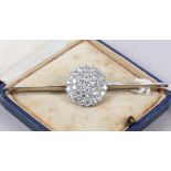 A white metal and diamond cluster bar brooch