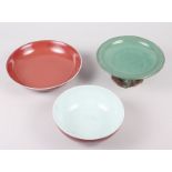 A Chinese sang de beouf bowl, 5 3/4" dia, a similar dish and a green glazed raised dish