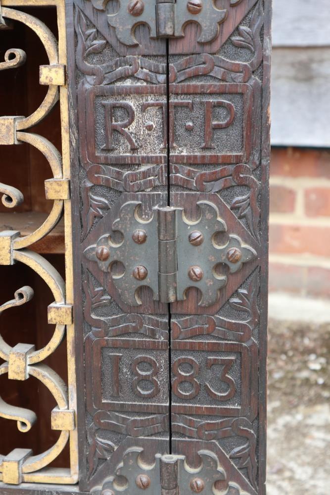 A 19th century carved oak corner cupboard, inscribed RTP 1883, with wrought iron grille door, 20" - Image 3 of 3
