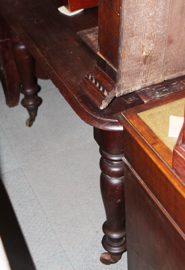 A 19th century mahogany extending dining table with centre leaf and winding handle, on turned - Image 2 of 2