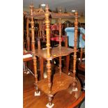 A Victorian walnut three-tier whatnot inlaid vase design, 19" wide and two Victorian circular