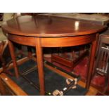 A 19th century mahogany semicircular side table, on chamfered and moulded supports, 46" wide x 23"