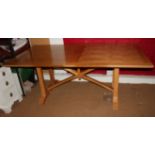 A Frank Hudson light oak refectory style dining table with panelled top, on square chamfered end