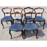 A Harlequin set of six William IV rosewood loop back dining chairs with stuffed over seats, on