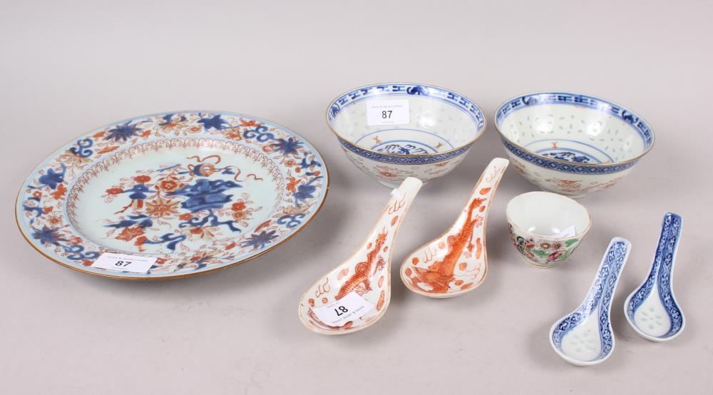 A 19th century Chinese famille rose plate, two "rice grain" pattern rice bowls, ladles, etc