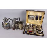A pair of silver plated shakers with blue glass liners, a water jug, a coffee pot, a tankard and a