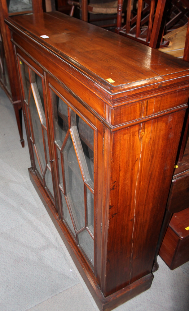 A Georgian design mahogany bookcase enclosed two astragal beaded glazed doors, on block base, 41"
