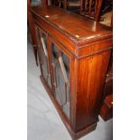 A Georgian design mahogany bookcase enclosed two astragal beaded glazed doors, on block base, 41"