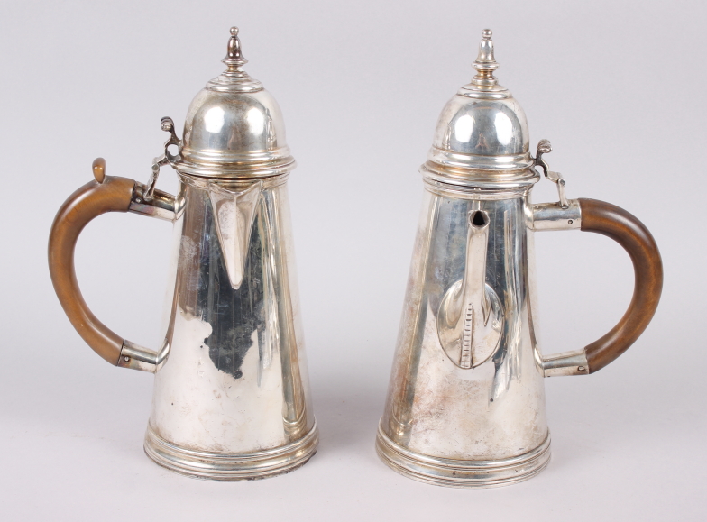 A Queen Anne design Britannia standard silver coffee pot with wooden handle and side spout,
