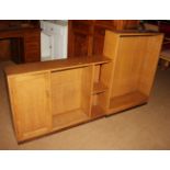 A two-section light oak bookcase and a shallow open shelf bookcase, 41" wide