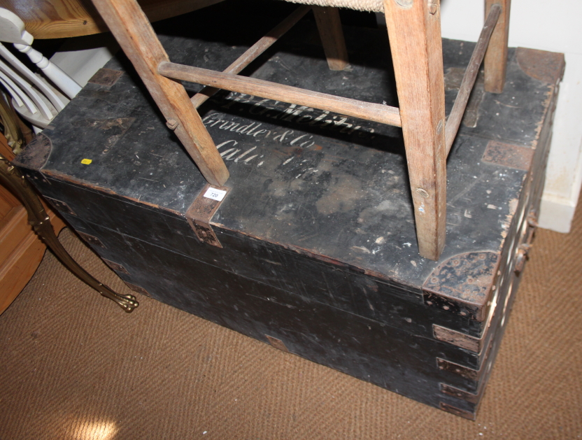 A black painted pine trunk with lid inscribed "Miss P G Melitus", 39" wide