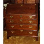 A Georgian oak fall front bureau, fitted four drawers with brass handles, 38" wide