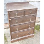 An oak chest of two short and three long graduated drawers, on block base, 29 1/2" wide