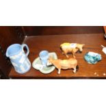 A Beswick china model of a Highland calf, two other unmarked models of a Jersey cow and frog, two