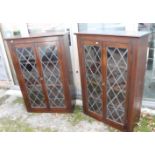 A pair of oak bookcases with astragal glazed doors, on block base, 30 3/4" wide