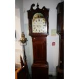 An early 19th century mahogany and line inlaid long case clock with painted arch top dial, eight-day