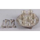 A Victorian silver five-piece egg cruet, on stand, with engraved and pierced decoration, and five