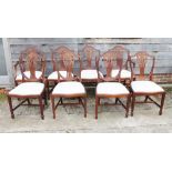 A set of eight Sheraton design shield back dining chairs with drop-in seats, on square taper