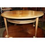 A Peter Hvidt teak two-tier circular coffee table, on turned and tapering supports, 38 1/2" dia
