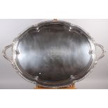 A silver two-handled tray with gadrooned border, retailed by Mappin & Webb, 150oz troy approx (