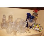 A soda syphon, a pair of blue glass candlesticks, an art glass ashtray and other glassware, various