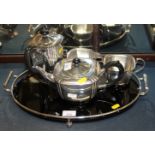 An Art Deco silver plated four-piece tea and coffee set with black coloured glass and a plated