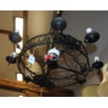 A wrought iron eight-light ceiling pendant, 27" dia max