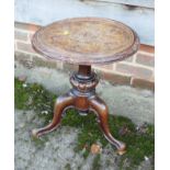 A late 19th century carved oak circular to low occasional table, on carved tripod supports, 16" dia,