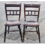 A set of three 19th century spindle back Windsor side chairs with elm panel seats, on turned and