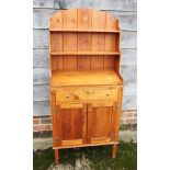 A pine bookcase bureau, fitted single drawer over two doors, 24" wide