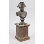 A 19th century bronze bust of Napoleon, on square plinth base, 11 1/2" high