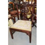 A mahogany carver armchair of Chippendale design with carved splat and tapestry drop-in seat (