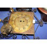 A Jackson of Henley long case clock face with gilt dial, Roman numerals with key, pendulum and