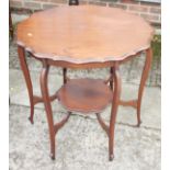 An Edwardian shape top two-tier occasional table, on cabriole supports, 28" dia x 27" high