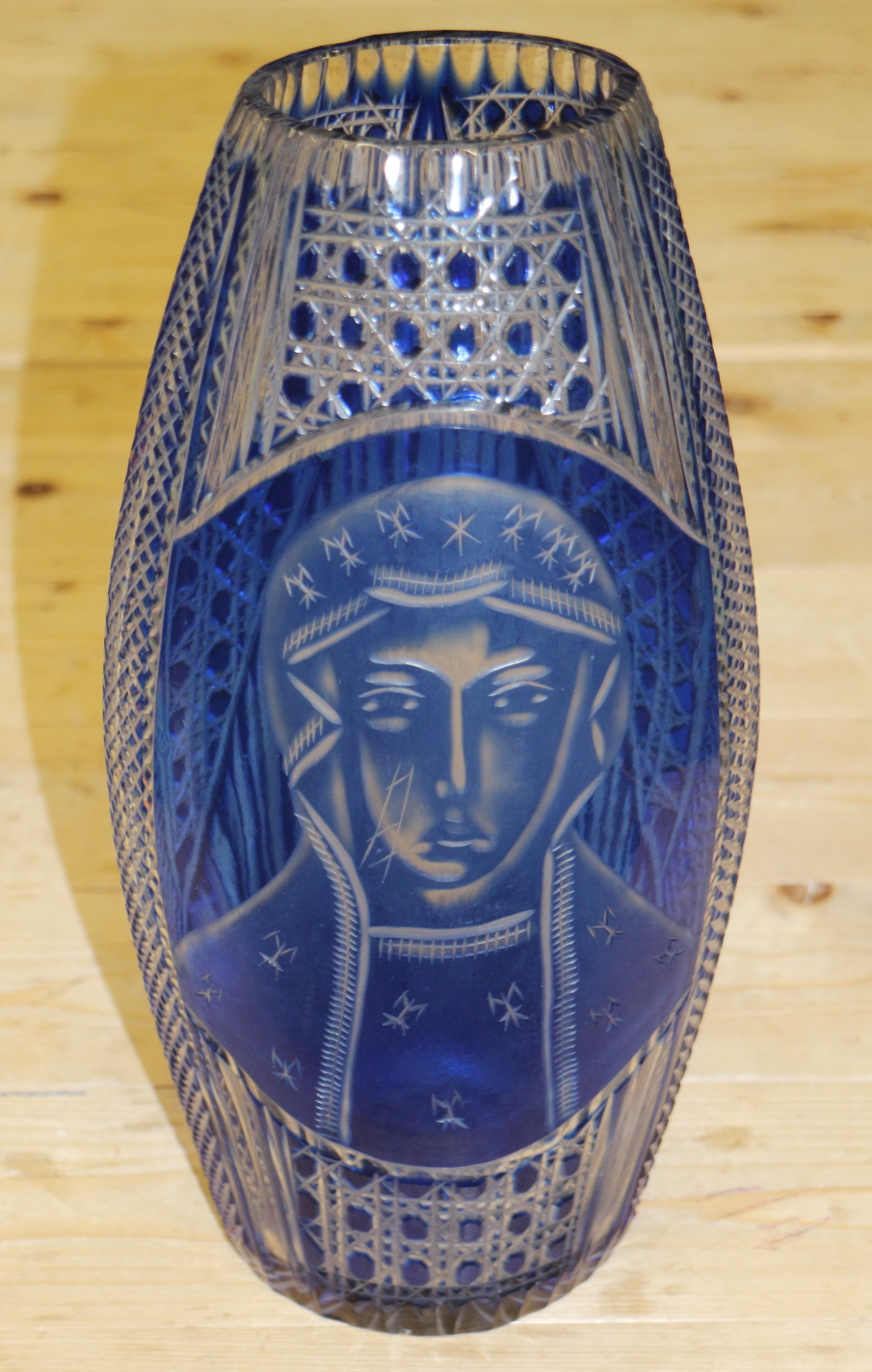 A 1950s blue overlaid cut and engraved glass vase with orthodox Madonna figure, 14 1/2" high