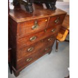 A George III oak and mahogany banded chest of two short and three long drawers with oval brass