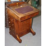 A late Victorian walnut and line inlaid Davenport desk with fitted interior and four drawers, 21"