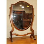 A mahogany shield shaped toilet mirror, on skeleton stand, 15" wide x 23 1/2" high