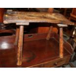 An 18th century chip carved provincial elm stool, on splay supports, 26" long x 9 1/2" wide x 17"