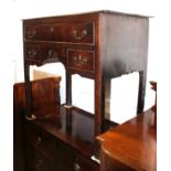 A late 18th century oak lowboy, fitted one long drawer over two small drawers, on chamfered