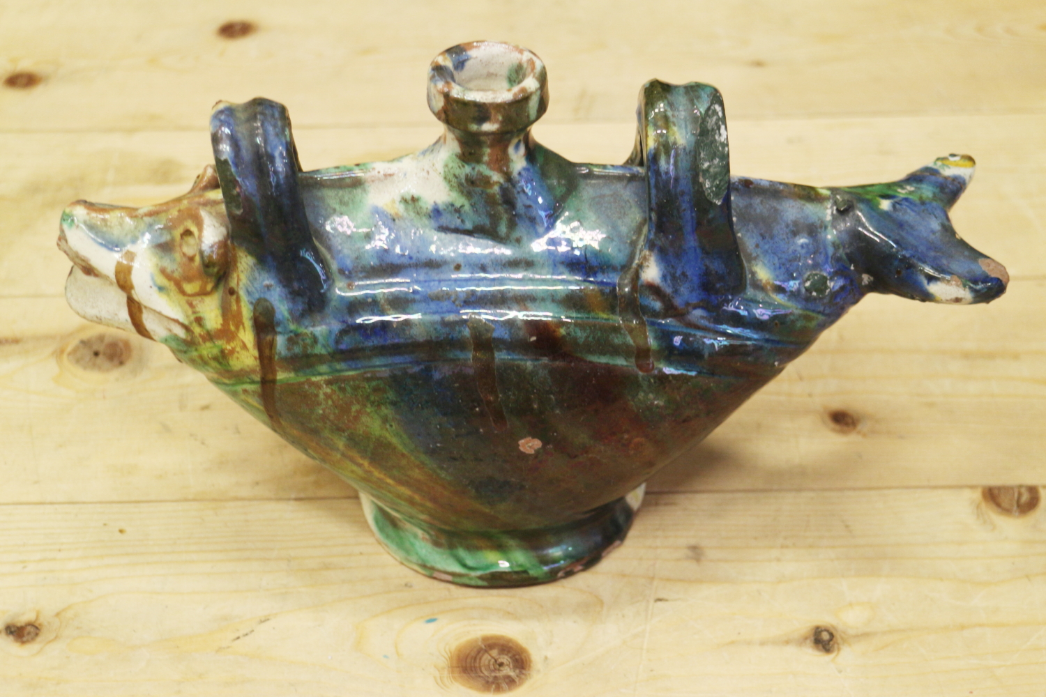 An Ottoman ceramic bottle, formed as a fish, with blue and green splashed glaze, 11 1/2" wide